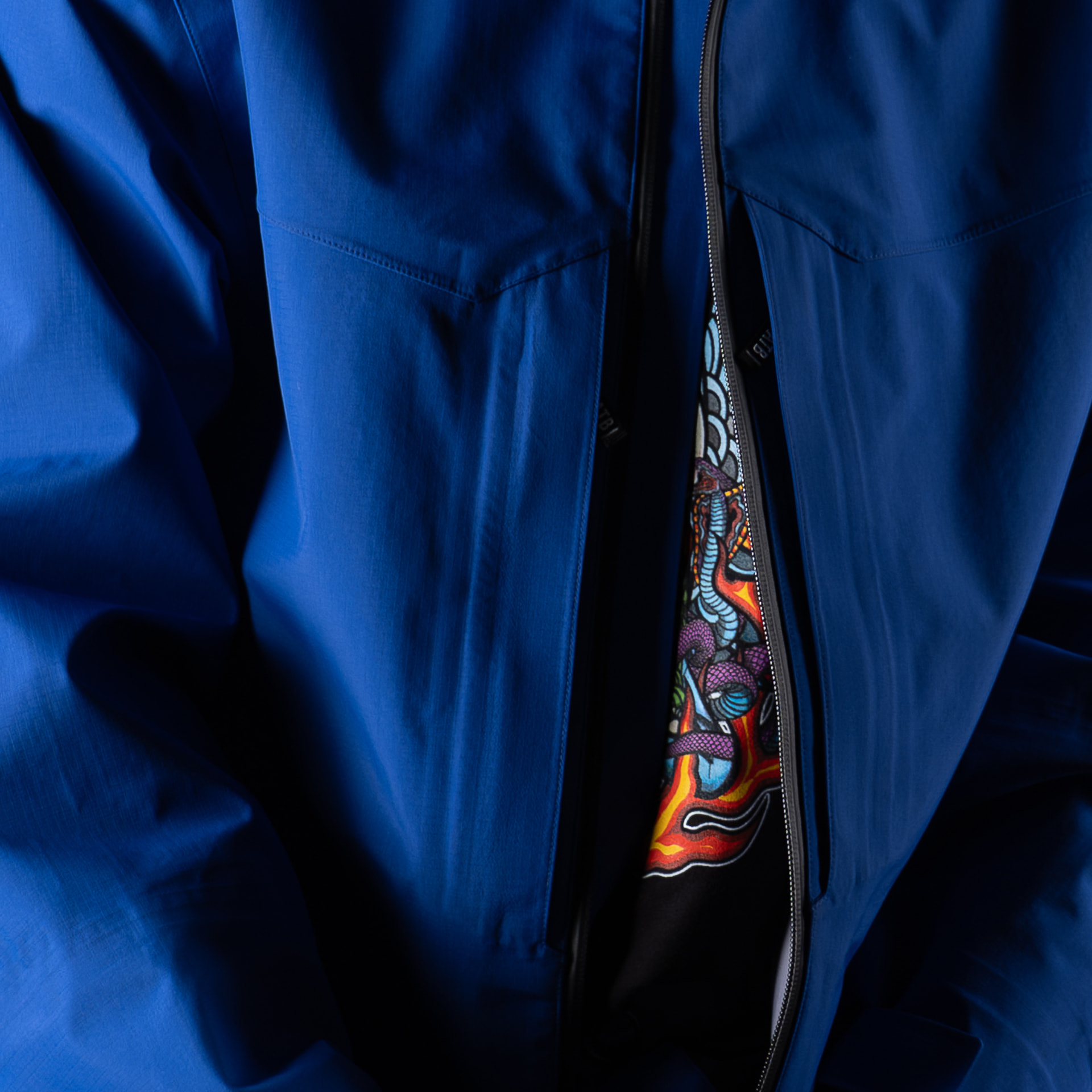 Front pocket layout on the blue Auburn Jacket