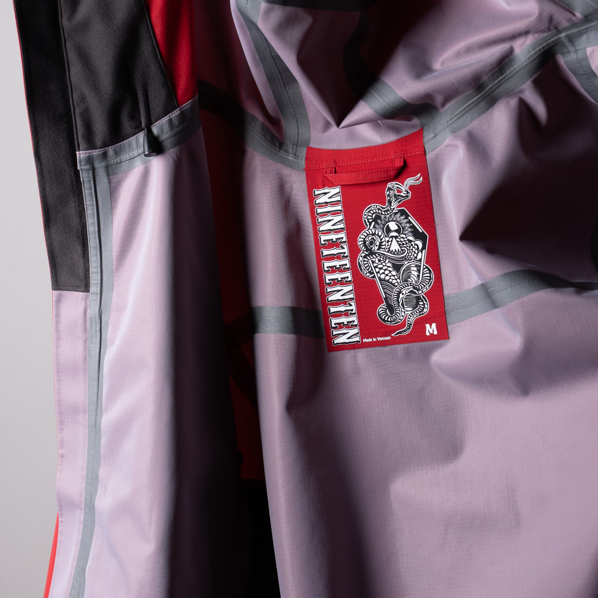 Inside of the Auburn Jacket showing the three-layer shell, taped seams and Nineteenten label